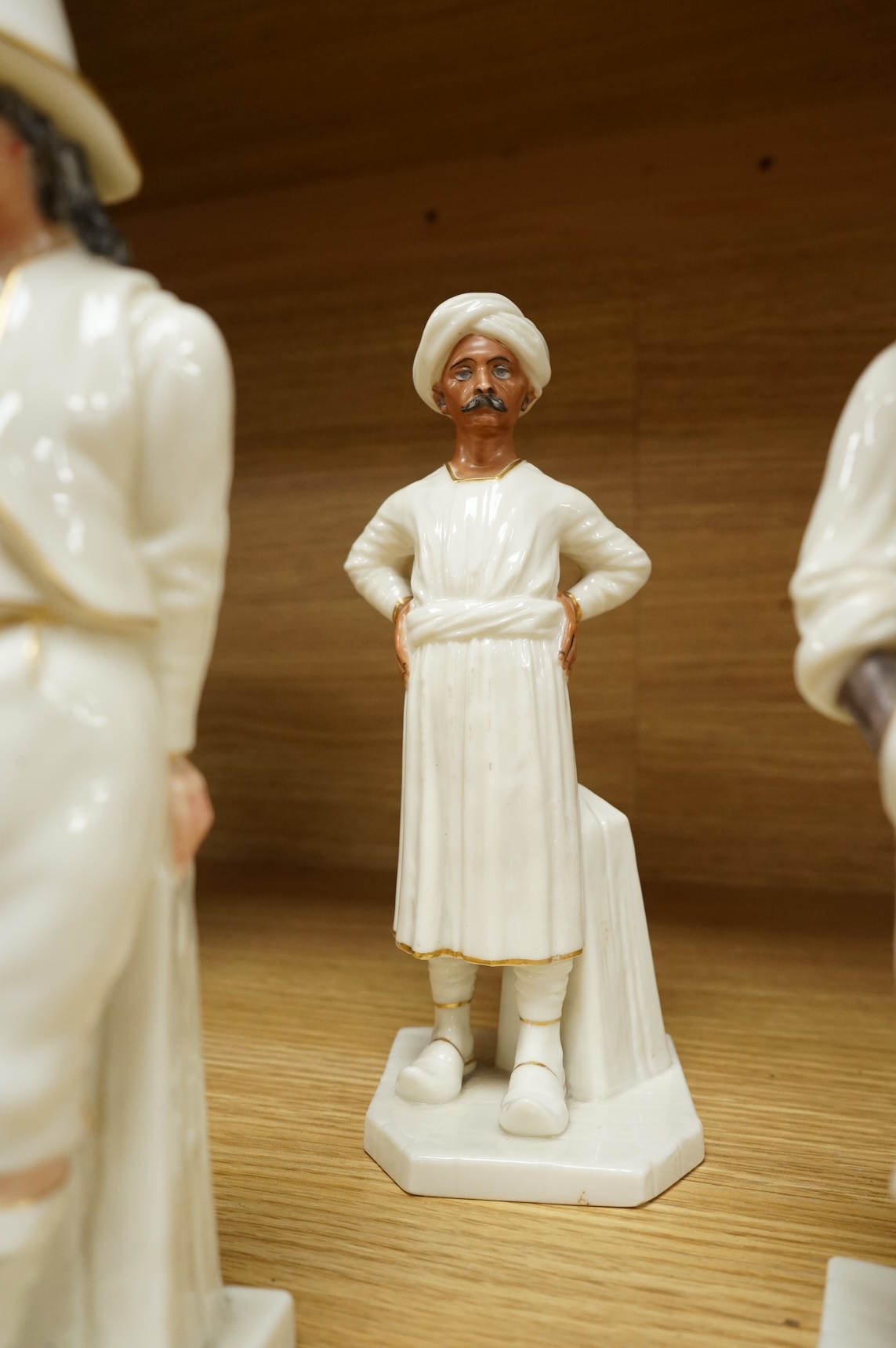 Four Royal Worcester figures from the Countries of the World Series to include Hindu and Chinaman, largest 18cm high